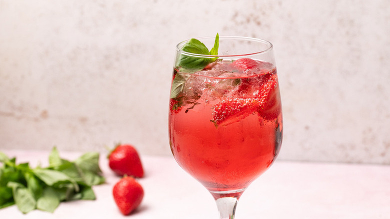 Strawberry and basil white wine spritzer in glass