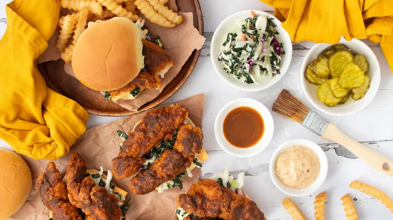 Copycat Dave's Hot Chicken Sandwiches on table with ingredients