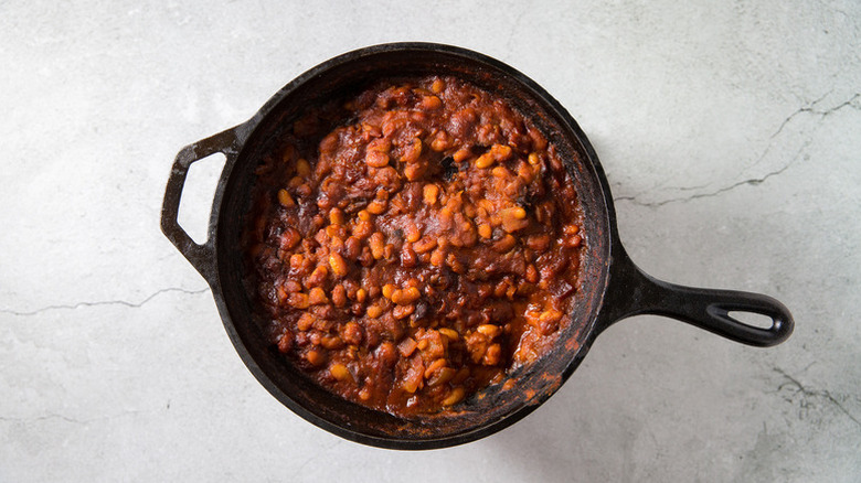 Spicy baked beans in skillet
