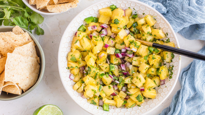 Bowl of pineapple salsa with cilantro and red onion