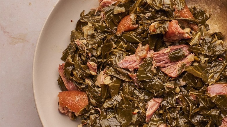 Bowl of Southern collard green with ham hock