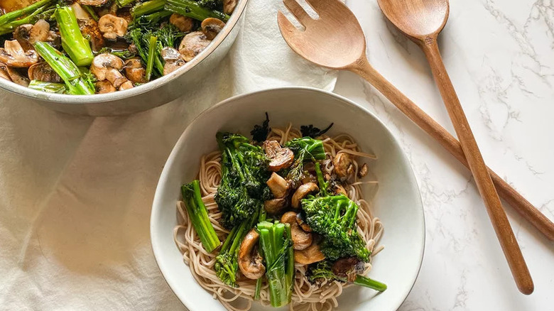 Soba Noodle Bowl with Mushrooms and Broccolini in white bowl on beige towel