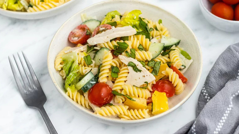 Chicken Pasta Salad in shallow beige bowl