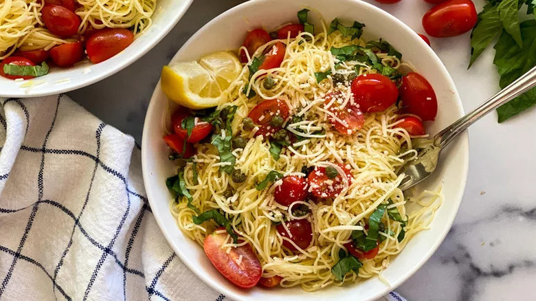 Cold Lemon Capellini Salad in white bowl with fork