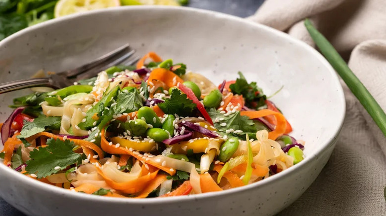 Colorful Toasted Sesame Noodle Salad in large white bowl