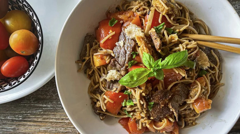 Panzanella-Style Beef and Noodles Summer Salad in large with bowl with chopsticks