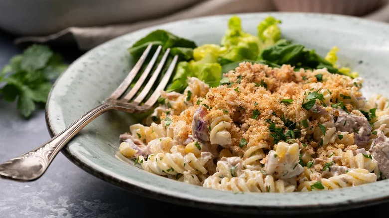 Zippy Tuna Pasta Salad with salad and fork in blue bowl