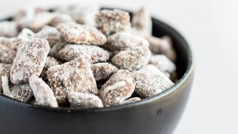 Chocolate-Coconut Puppy Chow in black bowl