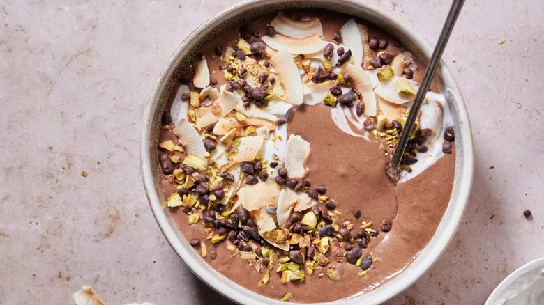 Chocolate Coconut Smoothie Bowl with spoon on countertop