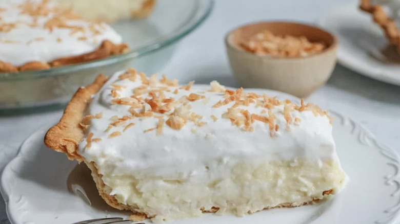 Classic Coconut Cream Pie on white plate