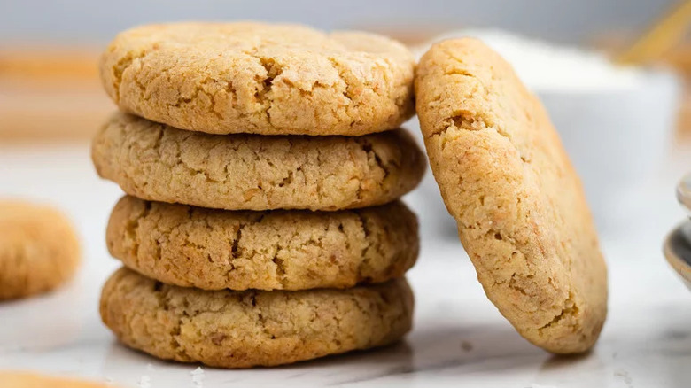 Coconut Cookies stacked on countertop