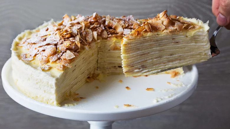 Coconut Crepe Cake on white cake stand