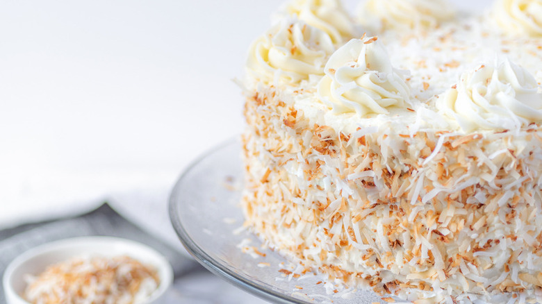 The Best Coconut Cake on glass cake stand