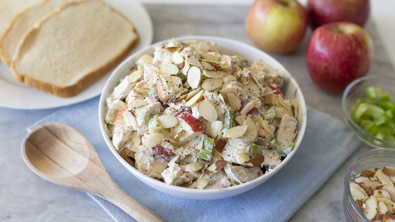 Bowl of chicken salad topped with flaked almonds