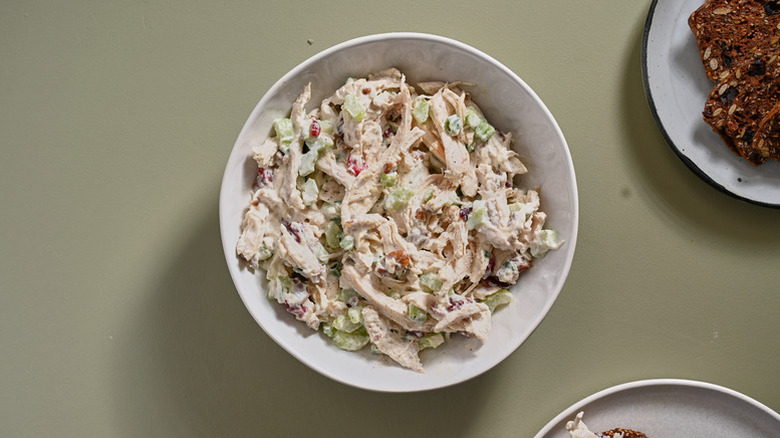Bowl of creamy chicken salad with cranberries and pecans