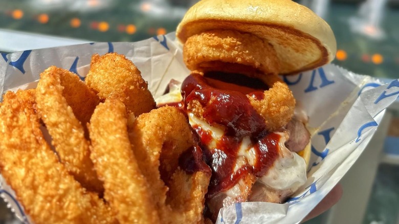 Z-man sandwich and onion rings on KC-branded paper