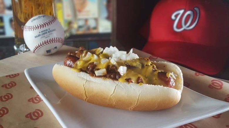 Half-smoke on plate with baskeball and Nationals hat in background