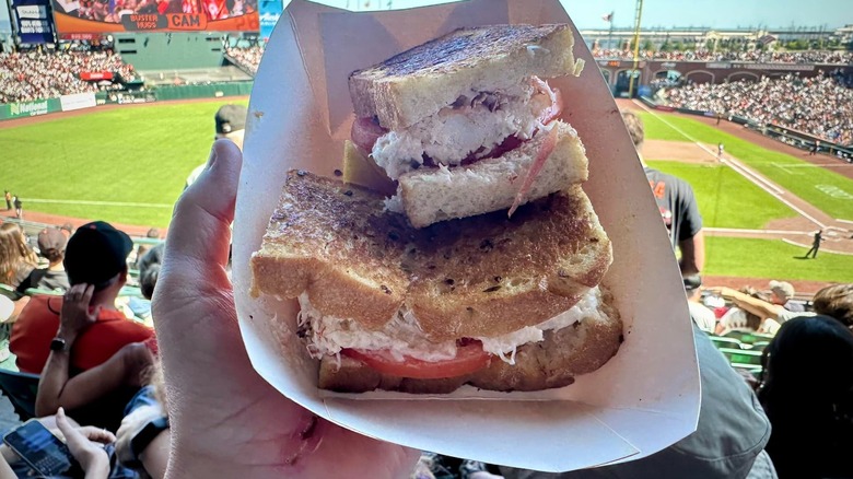 Crab sandwich in tray with blurred field in background