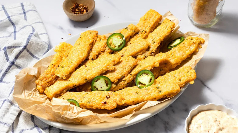 homemade spicy cheese straws on plate