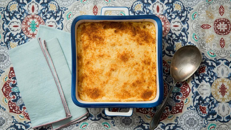 Cheese Grits Casserole in blue and white baking dish