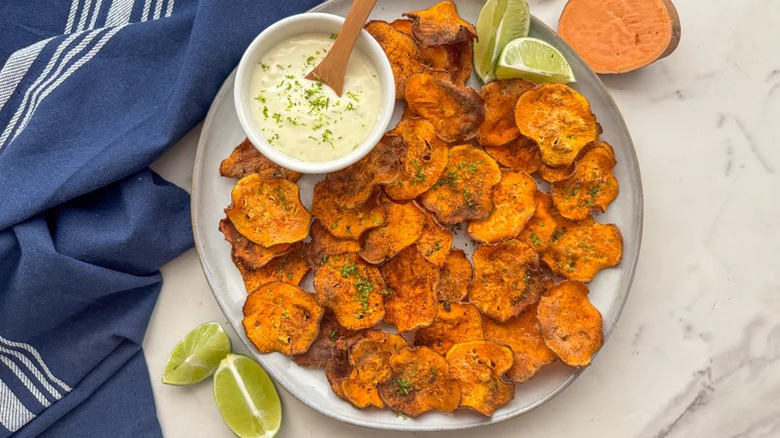 Chili Lime Sweet Potato Chips on white plate with blue towel