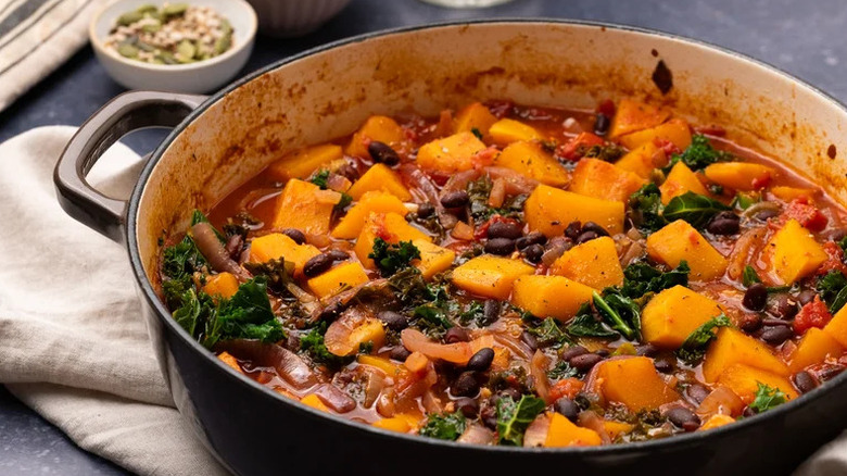 Hearty Pumpkin and Black Bean Casserole in large black pot