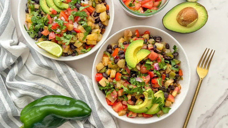 Poblano Potato Breakfast Hash in white bowls on countertop