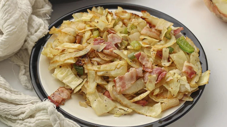 Southern-Fried Cabbage on black and white plate