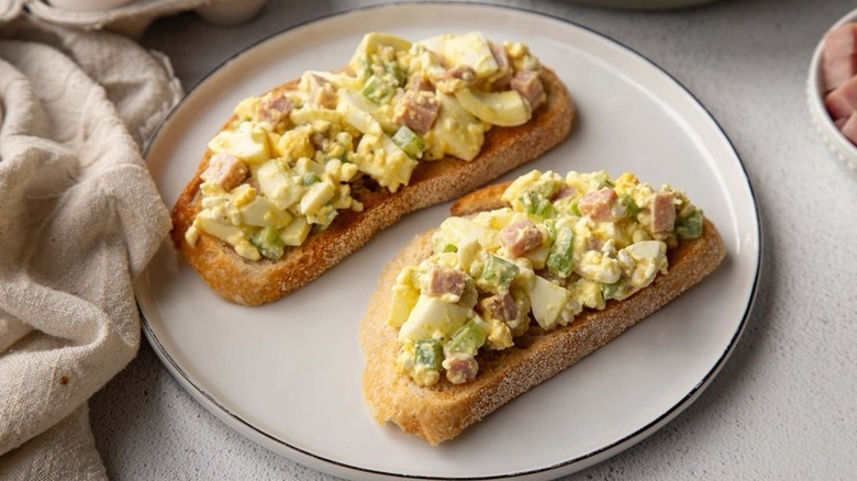 Two slices of toast topped with cottage cheese egg salad