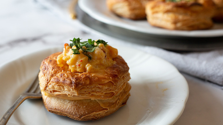 Lobster Newburg on white plate with fork