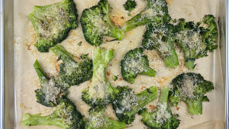 Parmesan smashed broccoli on baking sheet