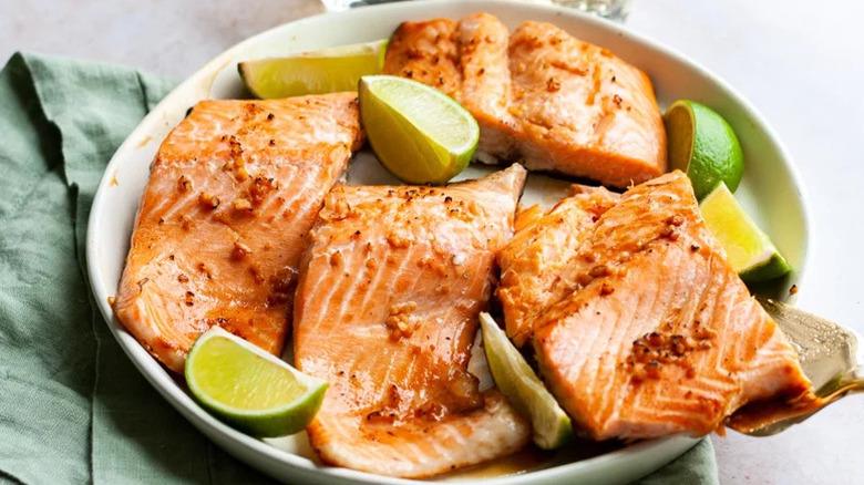 Honey Lime Salmon in white bowl with lime wedges