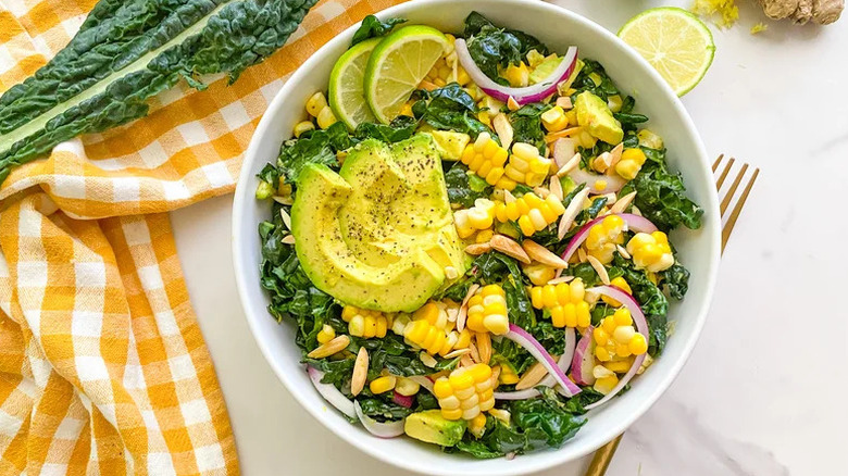 Kale and Corn Salad with Ginger-Lime Dressing in white bowl