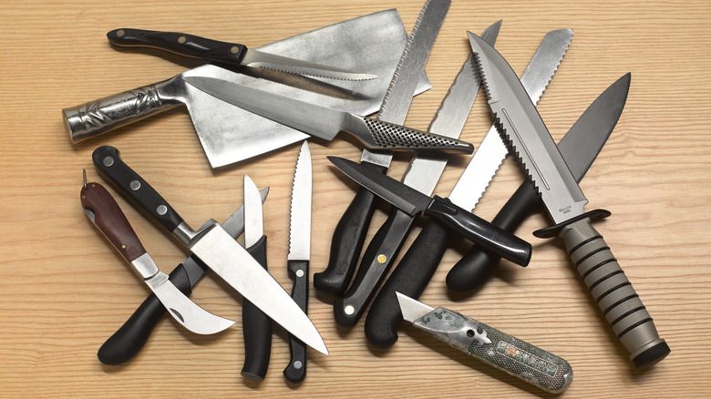 Collection of knives in pile