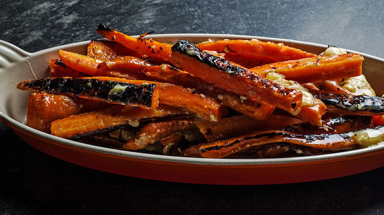 Roasted carrots with melty brie in baking dish