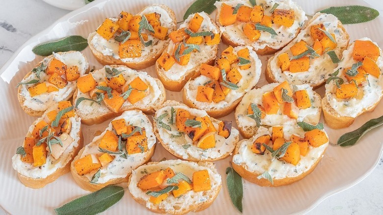 Ricotta, sage, and butternut squash bruschetta on serving platter