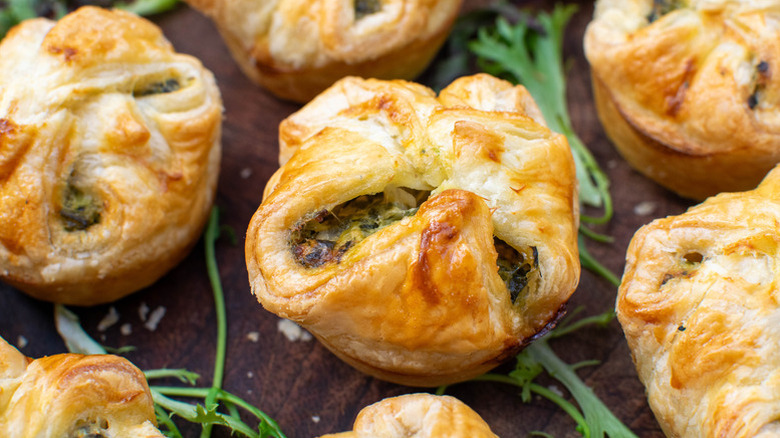 Close up of spinach and sun-dried tomato pastry puffs