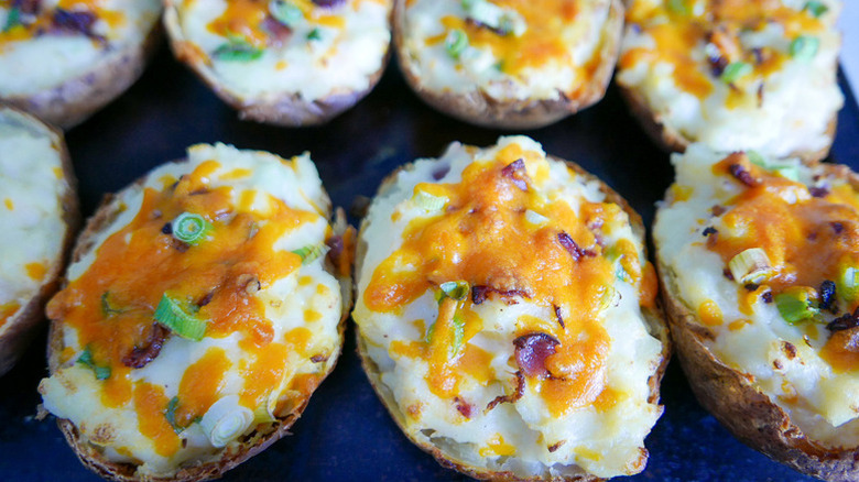 Close up of cheesy twice-baked potato halves