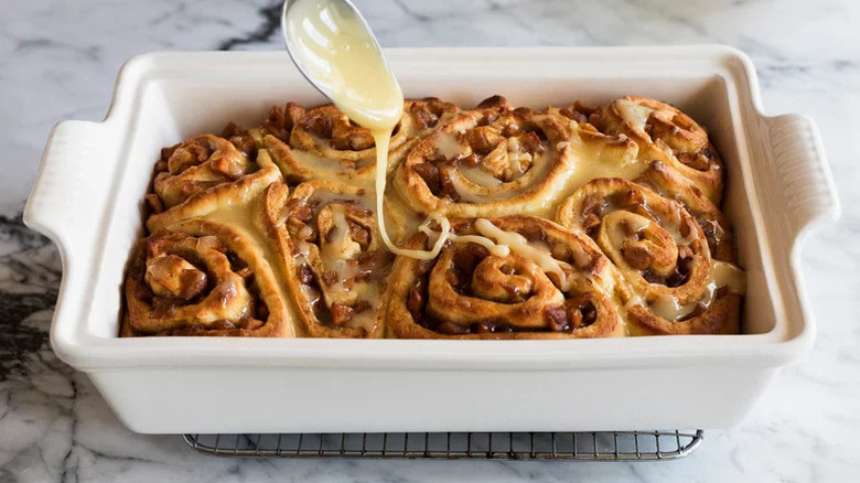 Apple Pie Cinnamon Rolls in white baking dish