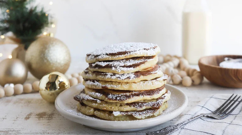 Cinnamon Bun Christmas Pancake on small white plate