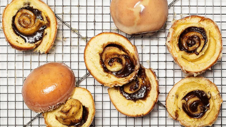 Cinnamon Roll Donut on metal drying rack
