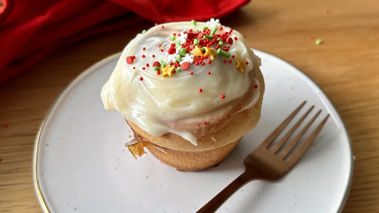 Gingerbread Cinnamon Bun on white plate with fork