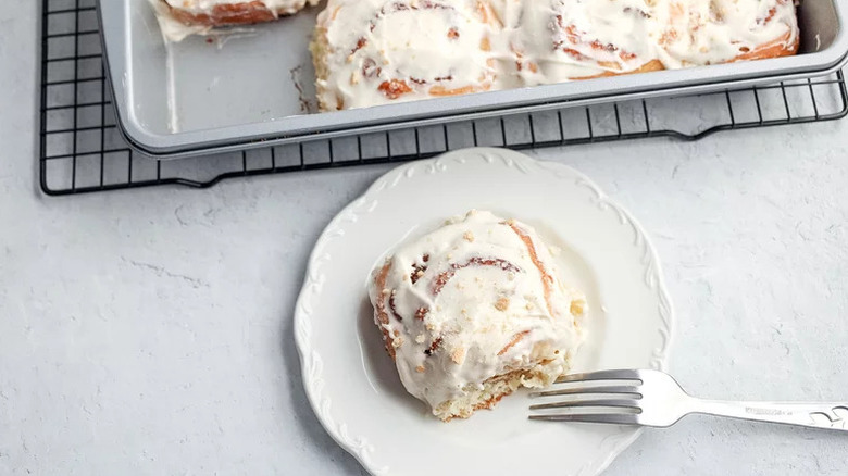 S'mores Cinnamon Rolls on white plate with fork