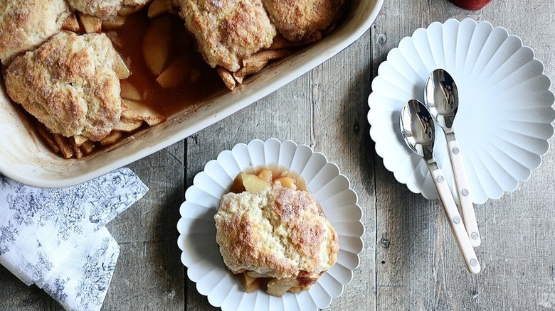 Apple cobbler served from baking dish onto plates
