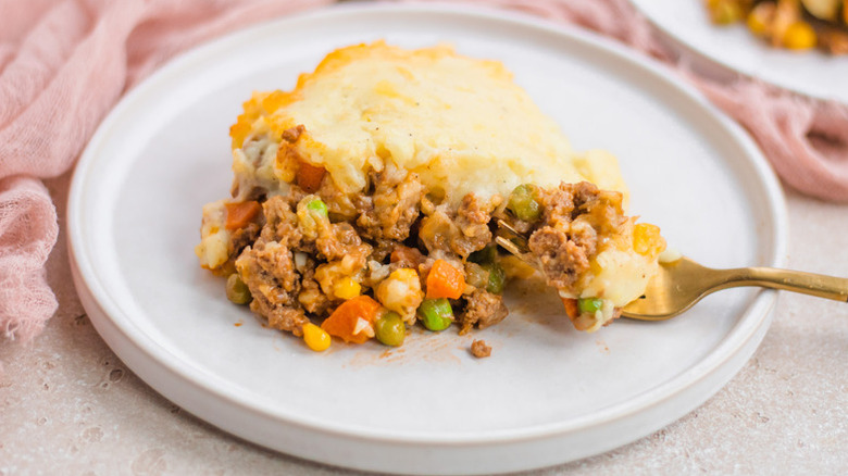 Portion of shepherd's pie on plate with fork