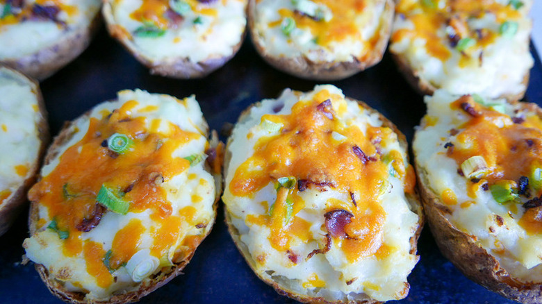 Close up of cheesy twice-baked potato halves