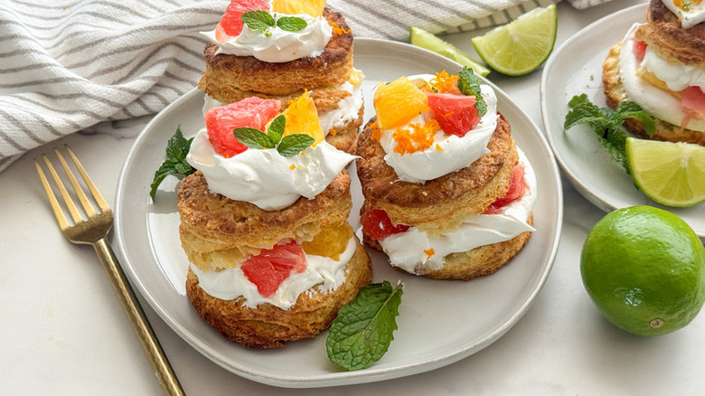 Citrus fruit shortcakes on a plate, garnished with mint leaves