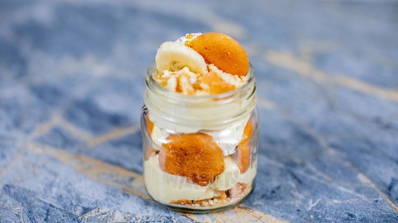 Banana pudding with vanilla wafers in an individual glass jar