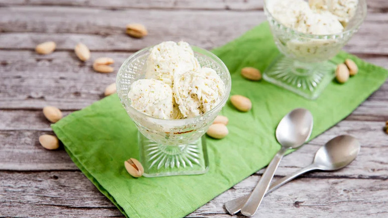 The Best 3-Ingredient Pistachio Ice Cream in glass goblet on green napkin