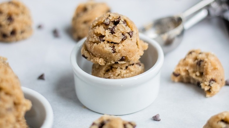 Scoops of edible cookie dough in white ramekin